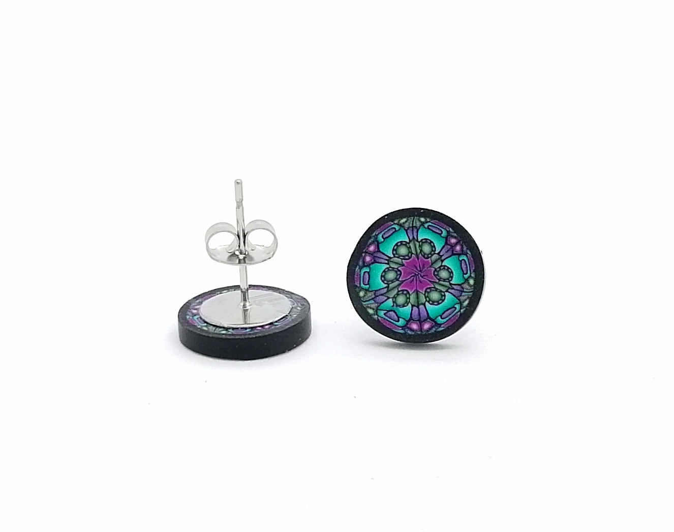 Round earrings with a colorful mandala design on a white background