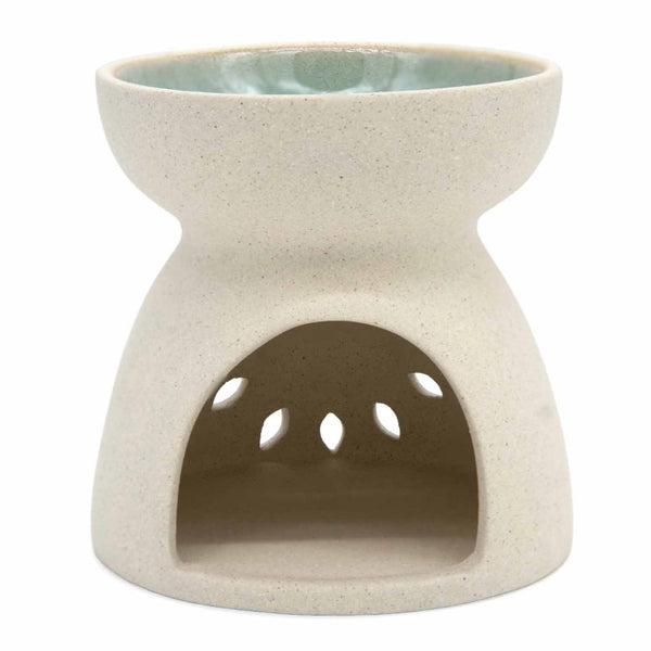 A ceramic oil burner warmer with a speckled cream-beige exterior and a light blue glazed interior, shown on a plain white background.