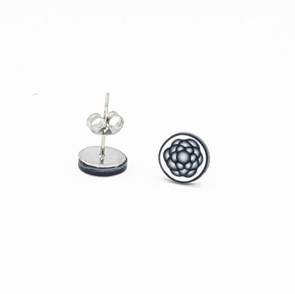 Gemoetric grey black and white stud earrings on a white background