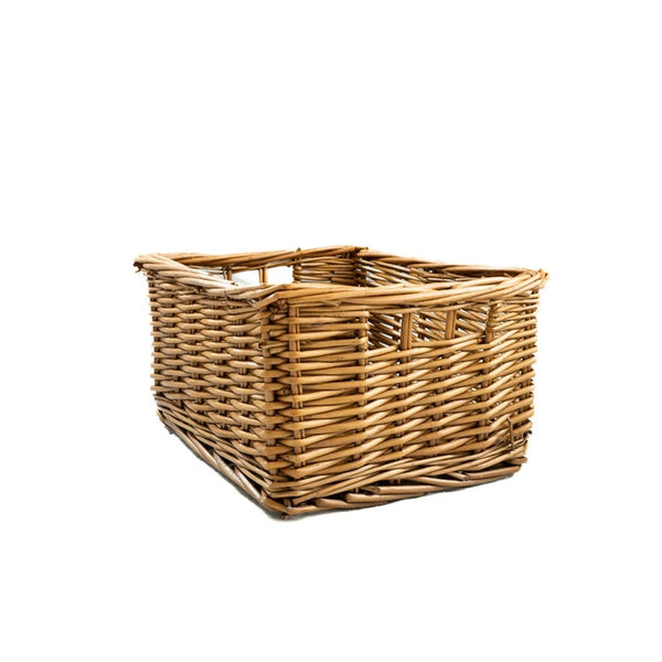 A rectangular woven wicker basket with a natural light brown color, shown from a three-quarters perspective on a solid white background.