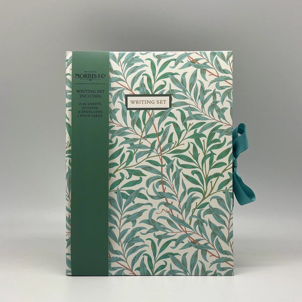 Writing set with leaf pattern packaging on a gray background