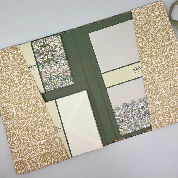 Open book with patterned pages on a light gray background