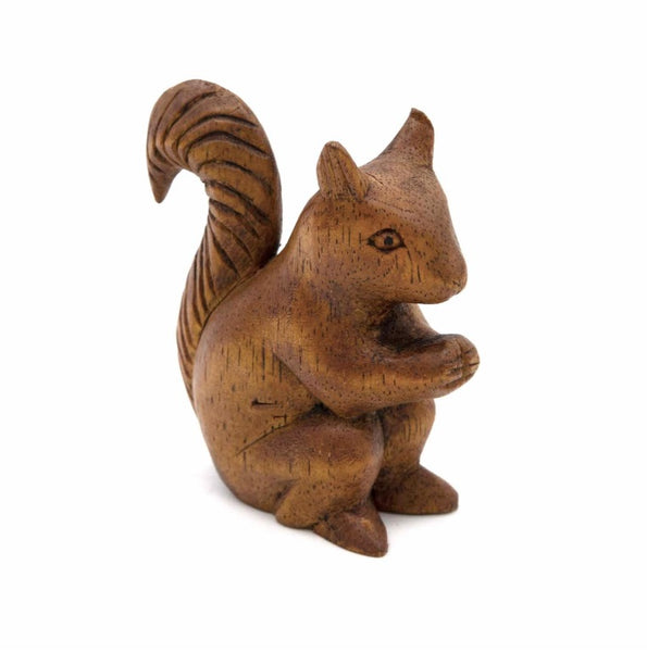 Wooden squirrel figurine on a white background