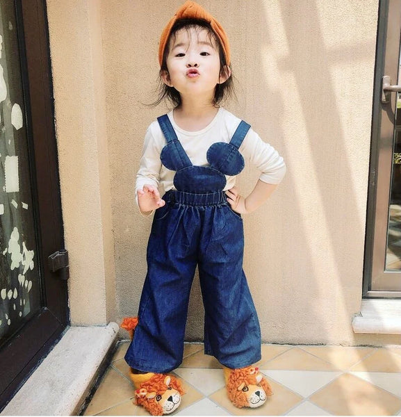 Little girl model wearing handmade felted leopold lion shoes by Sew Heart Felt